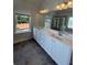 Bathroom with double vanity, modern fixtures and ample storage, offering a bright space at 4520 Ajo Walk, Atlanta, GA 30331