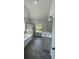Bright bathroom features a double vanity, tub, and separate shower with sleek fixtures at 4520 Ajo Walk, Atlanta, GA 30331