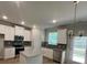 Modern kitchen with white cabinets, stainless steel appliances, and granite countertops at 4520 Ajo Walk, Atlanta, GA 30331