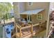 Second story deck with stairs leading to ground level patio and motorized awning over french doors at 3311 Lost Meadows Ln, Buford, GA 30519