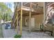 Backyard patio with stairway to wooden deck and well maintained lawn and garden at 3311 Lost Meadows Ln, Buford, GA 30519