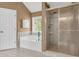 Bathroom showing a soaking tub and a separate shower area with tile accents at 3311 Lost Meadows Ln, Buford, GA 30519