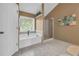Inviting bathroom featuring a soaking tub and a separate shower area with tile accents at 3311 Lost Meadows Ln, Buford, GA 30519