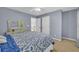 Comfortable bedroom featuring a window, carpet, and neutral-toned walls at 3311 Lost Meadows Ln, Buford, GA 30519