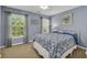 Stylish bedroom with two windows, patterned curtains, and a white metal frame bed at 3311 Lost Meadows Ln, Buford, GA 30519