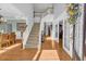 Bright entryway with hardwood floors, staircase, and elegant glass doors at 3311 Lost Meadows Ln, Buford, GA 30519