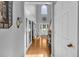 Hallway with hardwood flooring and white trim and natural light at 3311 Lost Meadows Ln, Buford, GA 30519