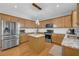 Well-equipped kitchen with granite countertops, a stylish island, and stainless-steel appliances at 3311 Lost Meadows Ln, Buford, GA 30519