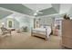 Expansive main bedroom with vaulted ceilings, a seating area, and neutral carpet at 3311 Lost Meadows Ln, Buford, GA 30519