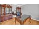 Home office with wooden desk, built-in cabinets, and neutral wall paint at 3311 Lost Meadows Ln, Buford, GA 30519