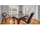 Office space featuring a large desk, comfortable chair, and natural light at 3311 Lost Meadows Ln, Buford, GA 30519