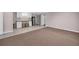 Room featuring tan carpeting, light gray walls, tile flooring, cabinets, sink, and stools at 3311 Lost Meadows Ln, Buford, GA 30519