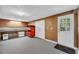 Room featuring concrete flooring, a closet, and a door with a window showcasing the landscape outdoors at 3311 Lost Meadows Ln, Buford, GA 30519