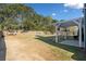 Expansive backyard featuring a pergola, mature trees, and a privacy fence at 419 Farmwood Way, Canton, GA 30115