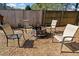 Cozy backyard firepit area with seating, perfect for entertaining guests outdoors at 419 Farmwood Way, Canton, GA 30115