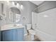 Neutral toned bathroom with walk in shower, sleek vanity, and framed mirror at 419 Farmwood Way, Canton, GA 30115