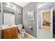 Bathroom featuring gray walls, a vanity, and toilet at 419 Farmwood Way, Canton, GA 30115