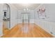 Bright dining room with hardwood flooring, wainscoting, and elegant chandelier at 419 Farmwood Way, Canton, GA 30115