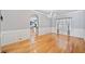 Bright dining room with hardwood floors, wainscoting, and a view of the adjacent kitchen at 419 Farmwood Way, Canton, GA 30115