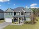 Inviting two-story home featuring charming curb appeal, a two-car garage, and lush landscaping at 419 Farmwood Way, Canton, GA 30115