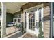 Close-up of a welcoming front door with decorative wreath, sidelights, and charming stone accents at 419 Farmwood Way, Canton, GA 30115