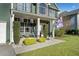 Charming front porch with seating area, decorative plants, and stone accents at 419 Farmwood Way, Canton, GA 30115