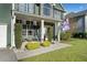 Close up of the front porch, featuring decorative plants and inviting seating at 419 Farmwood Way, Canton, GA 30115