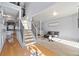 Spacious living room with neutral paint, hardwood floors, a staircase, and plenty of natural light at 419 Farmwood Way, Canton, GA 30115
