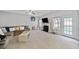 Spacious living room with a cozy fireplace, large windows, and a comfortable sectional sofa perfect for relaxation at 419 Farmwood Way, Canton, GA 30115