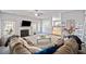 Bright living room showcasing a fireplace, open layout, and view into the kitchen, creating an inviting atmosphere at 419 Farmwood Way, Canton, GA 30115