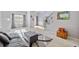 Cozy living room with plush seating, a patterned rug, and a view of the foyer and staircase at 419 Farmwood Way, Canton, GA 30115