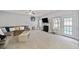 Open concept living room with a fireplace, large windows and lots of natural light at 419 Farmwood Way, Canton, GA 30115