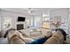 Spacious living room with a fireplace, a mounted TV, and views of the kitchen at 419 Farmwood Way, Canton, GA 30115