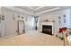 Comfortable living room featuring neutral carpet, a fireplace, and framed pictures at 419 Farmwood Way, Canton, GA 30115