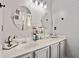Modern main bathroom with double sinks, large mirrors, and stylish fixtures at 419 Farmwood Way, Canton, GA 30115