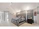 This main bedroom boasts neutral walls, carpet floors, and a luxurious upholstered headboard at 419 Farmwood Way, Canton, GA 30115
