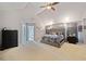 Spacious main bedroom featuring a vaulted ceiling, a large bed, and elegant furnishings at 419 Farmwood Way, Canton, GA 30115