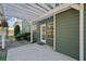 Back patio features a pergola, an exterior door, and green painted siding at 419 Farmwood Way, Canton, GA 30115