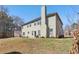 Back exterior featuring a green yard and patio area at 4316 Constellation Blvd, Snellville, GA 30039