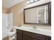 Bathroom showcasing vanity, framed mirror, shower-tub combo with white tile at 4316 Constellation Blvd, Snellville, GA 30039