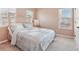 Comfortable bedroom with carpet, soft pink walls and bright windows with views at 4316 Constellation Blvd, Snellville, GA 30039