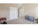 Bedroom featuring neutral carpet, vaulted ceiling, and a double door closet at 4316 Constellation Blvd, Snellville, GA 30039