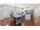 Spacious dining room features hardwood floors and a large dining table, perfect for entertaining guests at 4316 Constellation Blvd, Snellville, GA 30039