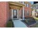 Inviting entryway with brick and stone accents, featuring a decorative front door and well-maintained landscaping at 4316 Constellation Blvd, Snellville, GA 30039