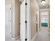 Hallway showing view into bedroom, featuring neutral walls and carpet at 4316 Constellation Blvd, Snellville, GA 30039