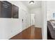 Bright hallway with hardwood floors, white trim, and stylish decor at 4316 Constellation Blvd, Snellville, GA 30039