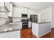 Bright kitchen featuring granite countertops, stainless steel appliances, and ample cabinet space at 4316 Constellation Blvd, Snellville, GA 30039