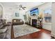 Comfortable living room with plush leather seating, a cozy fireplace, and stylish decor for relaxation and entertainment at 4316 Constellation Blvd, Snellville, GA 30039
