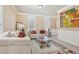 Bright living room with plush couches, large windows, and a decorative area rug offering a comfortable gathering space at 4316 Constellation Blvd, Snellville, GA 30039