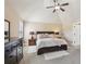 Cozy bedroom featuring a vaulted ceiling, fan, neutral tones, and stylish furnishings at 4316 Constellation Blvd, Snellville, GA 30039